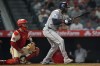 Houston Astros' Yordan Alvarez (44) watches his go-ahead RBI single against the Los Angeles Angels during the ninth inning of a baseball game Tuesday, July 28, 2026, in Anaheim, Calif. (AP Photo/Scott Strazzante)