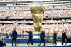 FIFA President Gianni Infantino waves when arriving with President Donald J. Trump, Mexico President Claudia Sheinbaum and Canada Prime Minister Mark Carney for the awards ceremony after the World Cup final soccer match between Spain and Argentina in East Rutherford, N.J., near New York, Sunday, July 19, 2026. (AP Photo/Ashley Landis)