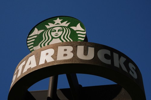 FILE - A Starbucks sign is seen outside the coffee company's global corporate headquarters, May 11, 2026, in Seattle. (AP Photo/Lindsey Wasson, File)