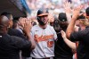 Baltimore Orioles' Dylan Beavers (12) celebrates scoring against the Detroit Tigers during the eighth inning of a baseball game Wednesday, July 29, 2026, in Detroit. (AP Photo/Paul Sancya)