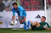 Cape Verde goalkeeper Vozinha gathers the ball ahead of former Mexican soccer player Luis Hernandez during a FIFA legends soccer match being played two days ahead of the World Cup final in New York, Friday, July 17, 2026. (AP Photo/Ashley Landis)