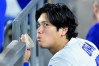 Los Angeles Dodgers Shohei Ohtani (17) watches from the dugout during the seventh inning of a baseball game against the Seattle Mariners, Tuesday, July 28 2026, in Los Angeles. (AP Photo/Wally Skalij)