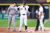 Chicago White Sox's Miguel Vargas (20) gestures after hitting a single as New York Yankees first baseman Paul Goldschmidt, left, and Chicago White Sox first base Jose Leger, right, look on during the fourth inning of a baseball game in Chicago, Wednesday, July 29, 2026. (AP Photo/Jessie Alcheh)