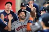 Houston Astros Jose Altuve (27) celebrates after scoring a run against the Los Angeles Angels during the seventh inning of a baseball game Wednesday, July 29, 2026, in Anaheim, Calif. (AP Photo/Wally Skalij)