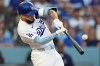 Los Angeles Dodgers' Andy Pages hits a home run against the Seattle Mariners during the first inning of a baseball game Wednesday, July 29, 2026, in Los Angeles. (AP Photo/Scott Strazzante)