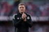 FILE - Newcastle's head coach Eddie Howe applauds to supporters at the end the English Premier League soccer match between Arsenal and Newcastle United in London, Saturday, April 25, 2026. (AP Photo/Ian Walton, File)