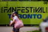 People pass signage outside the Fort York Toronto World Cup fan festival on Thursday, June 11, 2026. THE CANADIAN PRESS/Sammy Kogan