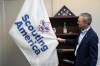 FILE - Roger Krone, chief executive officer of Scouting America, describes the design of the organization's flag in Irving, Texas, Feb. 5, 2025. (AP Photo/LM Otero, File)