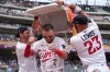 Minnesota Twins' Kody Clemens (2) is doused by teammates Ryan Kreidler, left, and Royce Lewis (23) after hitting a walk-off grand slam in the ninth inning of a baseball game against the Kansas City Royals, Thursday, July 30, 2026, in Minneapolis. (AP Photo/Abbie Parr)