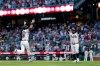 Atlanta Braves' Mike Yastrzemski (18) reacts with Braves third base coach Tommy Watkins (84) while rounding the bases after hitting a two-run home run against the Washington Nationals during the fifth inning of a baseball game, Thursday, July 30, 2026, in Atlanta. (AP Photo/Erik S. Lesser)