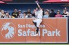 San Diego Padres right fielder Fernando Tatis Jr. makes the catch above the wall for the out on a sacrifice fly by San Francisco Giants' Rafael Devers during the first inning of a baseball game Thursday, July 30, 2026, in San Diego. (AP Photo/Gregory Bull)