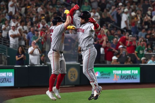 Boston Red Sox's Willson Contreras, right, celebrates with Caleb Durbin after hitting a home run during the eighth inning of a baseball game against the Athletics Thursday, July 30, 2026, in West Sacramento, Calif. (AP Photo/Sara Nevis)