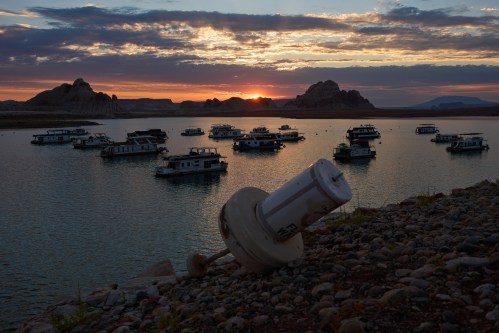 FILE - A formerly floating buoy now sits high and dry above Lake Powell at the Glen Canyon National Recreation Area, July 15, 2026, near Page, Nev. (AP Photo/John Locher, File)
