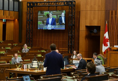 Former Conservative leader Andrew Scheer speaks and is projected onto large screens as he takes part in the COVID-19 Pandemic Committee in the House of Commons on Parliament Hill in Ottawa on Wednesday, May 27, 2020. THE CANADIAN PRESS/Sean Kilpatrick