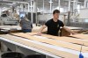 A man works in an architectural woodworking plant in Saint-Georges, Que., on Thursday, Feb. 6, 2025. THE CANADIAN PRESS/Jacques Boissinot