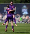 Calgary Wild's Ally Green, back right, and Kahli Johnson celebrate a goal against Vancouver Rise in Burnaby, B.C., on Saturday, May 24, 2025. THE CANADIAN PRESS/Darryl Dyck