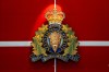 The RCMP crest hangs at a headquarters building in Surrey, B.C., on Wednesday, Feb. 11, 2026. THE CANADIAN PRESS/Ethan Cairns