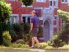 A pedestrian strolls past Vancouver College Thursday July 25, 2002. The B.C. Supreme Court has approved a $30-million settlement of a class-action lawsuit against Vancouver College and St. Thomas More Collegiate and the Archbishop of Vancouver over historical claims of sexual and physical abuse.(CP PHOTO/Chuck Stoody)