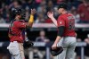 Arizona Diamondbacks catcher Gabriel Moreno, left, and pitcher Brandyn Garcia (55) celebrate after the Diamondbacks defeated the Guardians in a baseball game in Cleveland, Friday, July 31, 2026. (AP Photo/Sue Ogrocki)