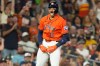Houston Astros' Cam Smith celebrates after hitting a triple against the Texas Rangers during the fourth inning of a baseball game Friday, July 31, 2026, in Houston. (AP Photo/David J. Phillip)