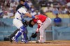 Boston Red Sox's Willson Contreras, right, is checked on by Los Angeles Dodgers catcher Eliezer Alfonzo after being hit by a pitch during the third inning of a baseball game Friday, July 31, 2026, in Los Angeles. (AP Photo/Mark J. Terrill)