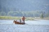 A drift boat with people fly fishing floats down the Yellowstone River, Friday, July 31, 2026, near Livingston, Montana. (AP Photo/Matthew Brown)