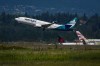 A WestJet Boeing 737-800 aircraft takes off from Vancouver International Airport, in Richmond, B.C., on Friday, July 31, 2026. WestJet says it has begun parking aircraft ahead of a possible strike by flight attendants as bargaining with the Canadian Union of Public Employees, which represents 4,400 flight attendants, continues in the hope of reaching agreement on a new contract and avoiding a work stoppage. THE CANADIAN PRESS/Darryl Dyck