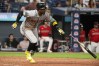 Arizona Diamondbacks' Geraldo Perdomo watches his two-run single off Cleveland Guardians relief pitcher Tim Herrin during the ninth inning of a baseball game, Saturday, Aug. 1, 2026, in Cleveland. (AP Photo/Phil Long)