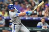 Kansas City Royals' Lane Thomas singles off Colorado Rockies starting pitcher Tomoyuki Sugano in the sixth inning of a baseball game Friday, July 31, 2026, in Denver. (AP Photo/David Zalubowski)