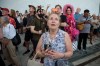 FILE - A crowd sings, 