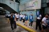 Travellers pass WestJet flight attendants on strike at Pearson International Airport in Toronto, on Sunday, Aug. 2, 2026. THE CANADIAN PRESS/Sammy Kogan