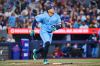Toronto Blue Jays' George Springer (4) hits a triple during seventh inning MLB baseball action against the St. Louis Cardinals in Toronto, on Sunday, Aug. 2, 2026. THE CANADIAN PRESS/Sammy Kogan