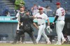 Home plate umpire Jonathan Parra (30) holds back Cleveland Guardians manager Stephen Vogt, center, between catcher Patrick Bailey, left, and pitcher Gavin Williams (32) during an argument in the sixth inning of a baseball game in Cleveland, Sunday, Aug. 2, 2026. (AP Photo/Sue Ogrocki)