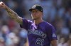 Colorado Rockies starting pitcher Kyle Freeland gestures to the crowd after throwing a complete basebaall game against the Kansas City Royals, Sunday, Aug. 2, 2026, in Denver. (AP Photo/David Zalubowski)