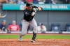 Arizona Diamondbacks' Tim Tawa fouls off a bunt attempt in the sixth inning of a baseball game against the Cleveland Guardians in Cleveland, Sunday, Aug. 2, 2026. (AP Photo/Sue Ogrocki)