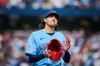 Toronto Blue Jays' Kevin Gausman (34) applauds to the crowd as he is taken out of the game by manager John Schneider during sixth inning MLB baseball action against the St. Louis Cardinals in Toronto, on Saturday, Aug. 1, 2026. THE CANADIAN PRESS/Sammy Kogan