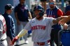 Boston Red Sox's Ceddanne Rafaela is greeted by teammates after scoring on a single hit by Sox's designated hitter Masataka Yoshida during the first inning of a baseball game, Sunday, Aug. 2, 2026, in Los Angeles. (AP Photo/Caroline Brehman)