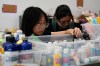 Shoppers look through art supplies for sale at the Brooklyn Creative Reuse on Wednesday, July 29, 2026, in the Brooklyn borough of New York. (AP Photo/Alyssa Goodman)