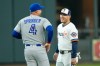 Toronto Blue Jays' George Springer (4) talks with former teammate Houston Astros' Daulton Varsho who was traded before their baseball game Monday, Aug. 3, 2026, in Houston. (AP Photo/David J. Phillip)