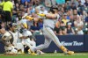 Pittsburgh Pirates' Spencer Horwitz hits a three-run double during the third inning of a baseball game against the Milwaukee Brewers, Monday, Aug. 3, 2026, in Milwaukee. (AP Photo/Aaron Gash)