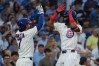 Chicago Cubs' Kevin Alcantara, right, is greeted by Dansby Swanson after hitting a two-run home run against the Los Angeles Dodgers during the second inning of a baseball game, Monday, Aug. 3, 2026, in Chicago. (AP Photo/David Banks)