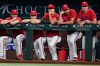 Texas Rangers' Jacob Degrom, from left, MacKenzie Gore, Jack Leiter, Nathan Eovaldi and Cody Bradford, right, stand in the dugout watching play against the San Francisco Giants in the first inning of a baseball game in Arlington, Texas, Monday, Aug. 3, 2026. (AP Photo/Tony Gutierrez)