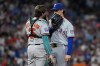 Baltimore Orioles' Adley Rutschman, left, Texas Rangers pitcher Jacob Latz talk in the seventh inning during the MLB baseball All-Star Game between the American League and National League, Tuesday, July 14, 2026, in Philadelphia. (AP Photo/Matt Slocum)
