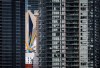 Internationally renowned graffiti artist Mirko Reisser's creation of the world's tallest mural is seen through high-rises in Calgary, Alta., Tuesday, June 28, 2022. THE CANADIAN PRESS/Jeff McIntosh