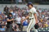 Milwaukee Brewers' Brandon Sproat walks to the dugout after being removed during the fourth inning of a baseball game against the Pittsburgh Pirates, Monday, Aug. 3, 2026, in Milwaukee. (AP Photo/Aaron Gash)