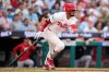 Philadelphia Phillies' Luis Arraez follows through after hitting a run-scoring double against Washington Nationals pitcher Zack Littell during the third inning of a baseball game Tuesday, Aug. 4, 2026, in Philadelphia. (AP Photo/Matt Slocum)