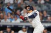 New York Yankees' George Lombard Jr. hits a home run during the fifth inning of a baseball game against the St. Louis Cardinals Tuesday, Aug. 4, 2026, in New York. (AP Photo/Frank Franklin II)