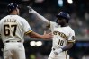 Milwaukee Brewers' Luis Lara (18) gestures after hitting an RBI single during the fifth inning of a baseball game against the Pittsburgh Pirates, Tuesday, Aug. 4, 2026, in Milwaukee. (AP Photo/Aaron Gash)
