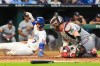 Kansas City Royals' Bobby Witt Jr. (7) beats the tag by Minnesota Twins catcher Ryan Jeffers to score on a fielder's choice hit into by Jac Caglianone during the fifth inning of a baseball game Tuesday, Aug. 4, 2026, in Kansas City, Mo. (AP Photo/Charlie Riedel)