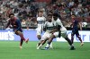 Atlante FC's Jhojan Julio (7) kicks the ball past Vancouver Whitecaps' Ralph Priso-Mbongue (6) to score during the first half of a Leagues Cup soccer match in Vancouver, on Tuesday, Aug. 4, 2026. THE CANADIAN PRESS/Ethan Cairns